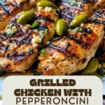 Grilled chicken breast topped with pepperoncini garlic butter, served with cucumber tomato salad and hummus on a white plate